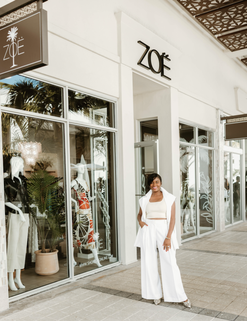 Nasheema, co-owner of ZOË Palm Beach Gardens, standing outside the boutique at Downtown at the Gardens.